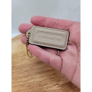 Coach Beige Hang Tag With Brass Chain